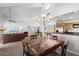 Dining area with a view of the living room and kitchen at 8466 E San Benito Dr, Scottsdale, AZ 85258