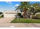 Single-story home with attached garage and lush landscaping at 8466 E San Benito Dr, Scottsdale, AZ 85258