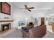 Spacious living room featuring a fireplace and large TV at 8466 E San Benito Dr, Scottsdale, AZ 85258