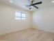 Bright bedroom with a modern ceiling fan, recessed lighting, and a window offering natural light at 8525 E Via De Los Libros --, Scottsdale, AZ 85258