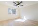 Bright bedroom with a modern ceiling fan and a window with a view at 8525 E Via De Los Libros --, Scottsdale, AZ 85258