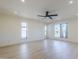 Spacious bedroom boasts recessed lighting, a modern ceiling fan, large windows, and light wood flooring at 8525 E Via De Los Libros --, Scottsdale, AZ 85258