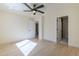 Bright bedroom features wood floors, recessed lighting, and a modern ceiling fan at 8525 E Via De Los Libros --, Scottsdale, AZ 85258