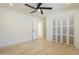 Bedroom with a ceiling fan, closet, and a connecting doorway at 8525 E Via De Los Libros --, Scottsdale, AZ 85258
