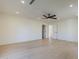 Open bedroom showcases hardwood floors, modern lighting, and access to two hallways with doors at 8525 E Via De Los Libros --, Scottsdale, AZ 85258