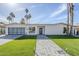 An attractive exterior with a glass garage door and an artificial lawn at 8525 E Via De Los Libros --, Scottsdale, AZ 85258