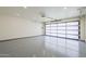 Bright garage features epoxy flooring and a paneled door for natural lighting at 8525 E Via De Los Libros --, Scottsdale, AZ 85258