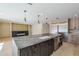 Spacious kitchen featuring a large island with a sink, stainless appliances and wood cabinets at 8525 E Via De Los Libros --, Scottsdale, AZ 85258