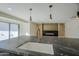 Close-up of the kitchen island featuring a sink, stone countertop, and stainless steel faucet at 8525 E Via De Los Libros --, Scottsdale, AZ 85258