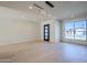Sun-filled living room with hardwood floors, recessed lighting, and a view of the front yard at 8525 E Via De Los Libros --, Scottsdale, AZ 85258