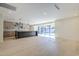 Bright open-concept living area connecting the kitchen and an outdoor swimming pool at 8525 E Via De Los Libros --, Scottsdale, AZ 85258
