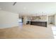 Open-concept living area with a modern kitchen and dining space, featuring hardwood floors at 8525 E Via De Los Libros --, Scottsdale, AZ 85258