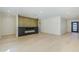 Bright and airy living room features a modern fireplace, light wood flooring, and neutral paint at 8525 E Via De Los Libros --, Scottsdale, AZ 85258