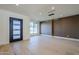 Bright living room featuring hardwood floors, modern lighting, and a front-facing window at 8525 E Via De Los Libros --, Scottsdale, AZ 85258