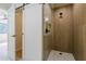 Walk-in shower with glass door and neutral tile, seamlessly blending style and functionality at 8525 E Via De Los Libros --, Scottsdale, AZ 85258