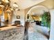 Elegant dining room with arched entryway and view of the kitchen at 10050 E Mountainview Lake Dr # 21, Scottsdale, AZ 85258