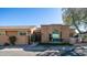 Front view of a charming home featuring arched windows and a well-maintained facade at 10841 N 9Th Pl, Phoenix, AZ 85020