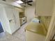 Bright kitchen with yellow countertops, white appliances, and tile floor at 13040 N 99Th Dr, Sun City, AZ 85351