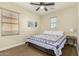 Spacious bedroom with ceiling fan and large bed at 13102 N 153Rd Ave, Surprise, AZ 85379