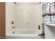 Clean bathroom with shower/tub combo and striped shower curtain at 14533 N 147Th Dr, Surprise, AZ 85379
