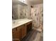 Clean bathroom with a shower/tub combo and wood vanity at 14533 N 147Th Dr, Surprise, AZ 85379