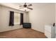 Bedroom with a tv, dresser, and ceiling fan at 14533 N 147Th Dr, Surprise, AZ 85379