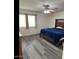 Bright bedroom featuring a king-size bed and neutral decor at 14533 N 147Th Dr, Surprise, AZ 85379