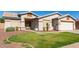 One-story house with a two-car garage and nicely landscaped yard at 14533 N 147Th Dr, Surprise, AZ 85379