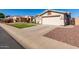 One story house with a two-car garage and landscaped yard at 14533 N 147Th Dr, Surprise, AZ 85379