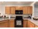 Clean kitchen, offering a microwave, oven and ample counter space at 14533 N 147Th Dr, Surprise, AZ 85379