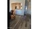 Bright living room with hardwood floors and access to a patio at 14533 N 147Th Dr, Surprise, AZ 85379