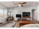 Living room with ceiling fan, TV, and ample space at 14533 N 147Th Dr, Surprise, AZ 85379