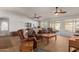 Bright living room featuring two ceiling fans and backyard access at 14533 N 147Th Dr, Surprise, AZ 85379