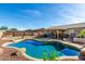 Stunning kidney shaped pool with ample patio space and hot tub at 14533 N 147Th Dr, Surprise, AZ 85379
