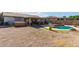 Inviting kidney shaped pool with surrounding gravel and landscaping at 14533 N 147Th Dr, Surprise, AZ 85379