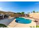 Relaxing kidney-shaped pool in a sunny backyard setting at 14533 N 147Th Dr, Surprise, AZ 85379