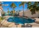 Relaxing kidney-shaped pool surrounded by a patio at 1491 W Armstrong Way, Chandler, AZ 85286