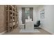 Modern home office with a desk, chair, and shelving at 15031 W Buckskin Trl, Surprise, AZ 85387