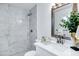 Bright bathroom featuring marble tiled shower, quartz countertop, and modern fixtures at 1521 E Del Rio Dr, Tempe, AZ 85282