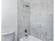 Bright bathroom features white marbled tile and modern fixtures at 1521 E Del Rio Dr, Tempe, AZ 85282
