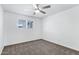 Bedroom with carpet flooring, a ceiling fan, and a window providing natural light at 1521 E Del Rio Dr, Tempe, AZ 85282