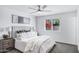 Bedroom with neutral tones, a ceiling fan, and bright sunlight at 1521 E Del Rio Dr, Tempe, AZ 85282