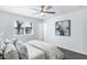 Bedroom features ceiling fan and large window with natural light at 1521 E Del Rio Dr, Tempe, AZ 85282