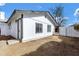 Home exterior with painted siding, dark trim and drought resistant yard at 1521 E Del Rio Dr, Tempe, AZ 85282