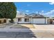 Charming single-story home featuring a well-maintained front yard and a two-car garage at 1521 E Del Rio Dr, Tempe, AZ 85282