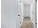 Hallway with white walls and doors and modern flooring at 1521 E Del Rio Dr, Tempe, AZ 85282