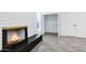 Living room featuring a brick fireplace and access to a closet and other rooms at 1521 E Del Rio Dr, Tempe, AZ 85282