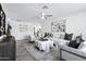 Bright living room featuring stylish furniture, ceiling fan and decor at 1521 E Del Rio Dr, Tempe, AZ 85282