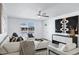 Bright living room featuring stylish furniture, a ceiling fan and view of the home's entrance at 1521 E Del Rio Dr, Tempe, AZ 85282