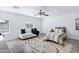 Bright living space featuring bed, seating, windows, and ceiling fan at 1521 E Del Rio Dr, Tempe, AZ 85282
